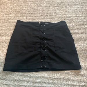 Black express skirt with criss cross details